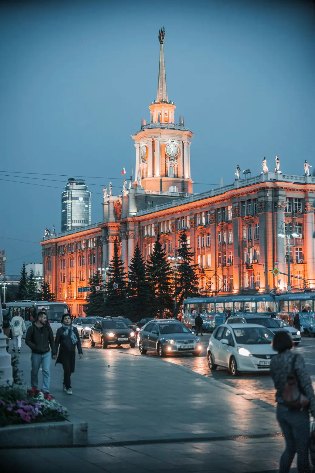 a large building with a clock tower at night