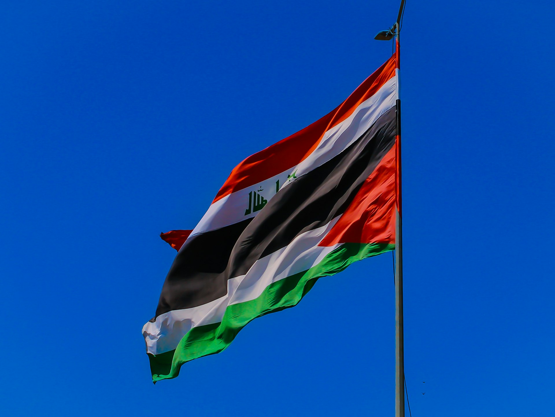 The flag of the united states flying in the wind