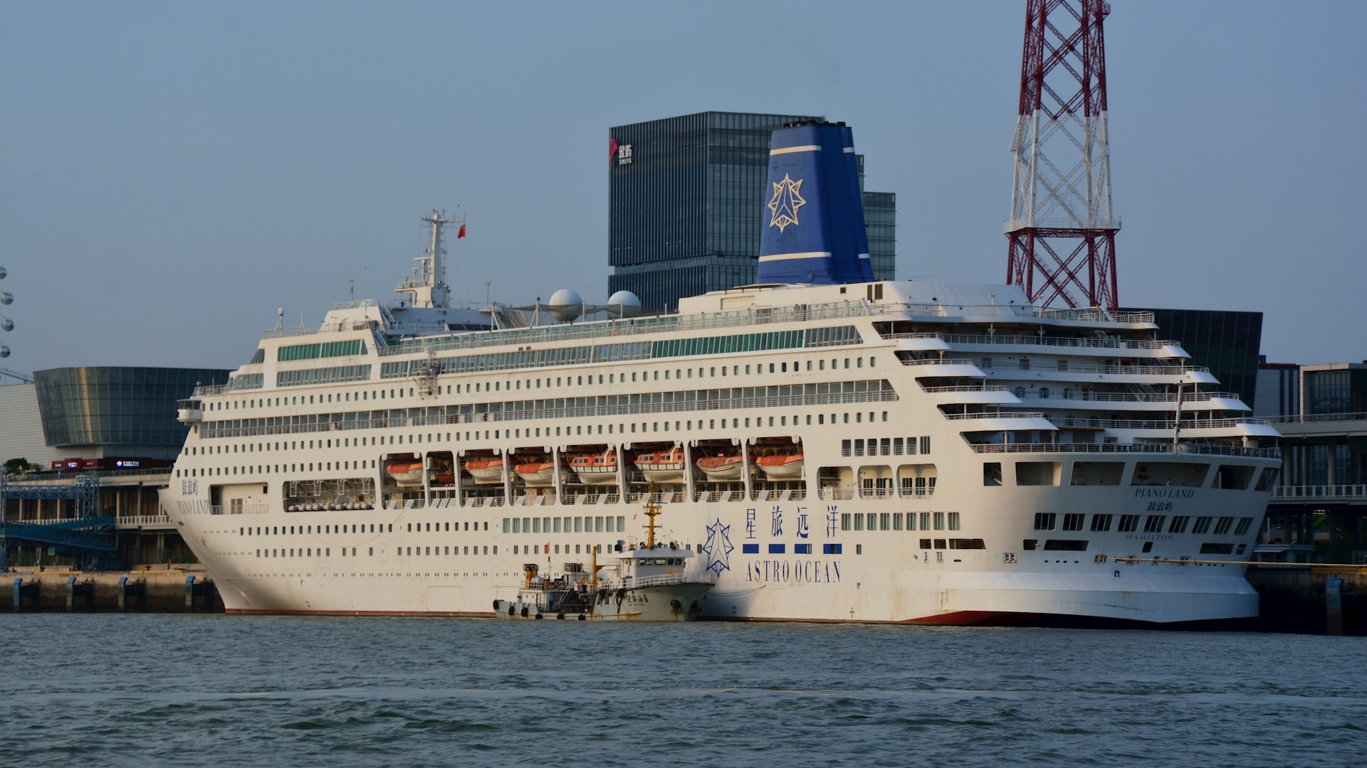 a large cruise ship docked in a harbor