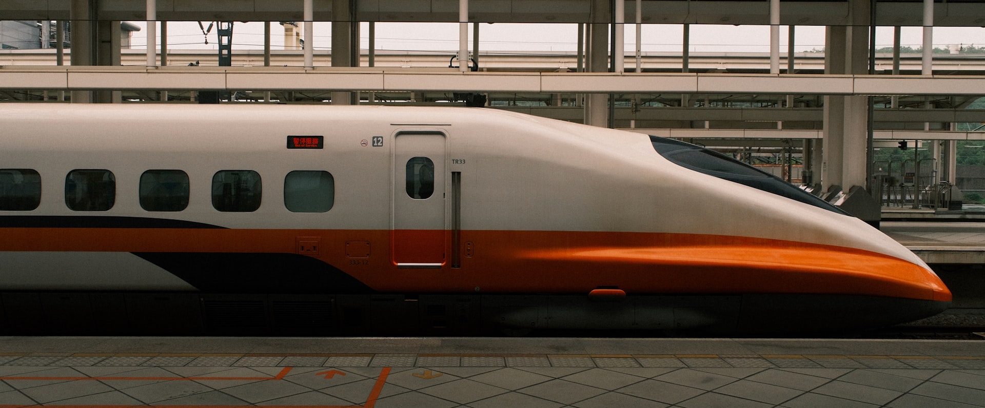 A high-speed train is stopped at a station.