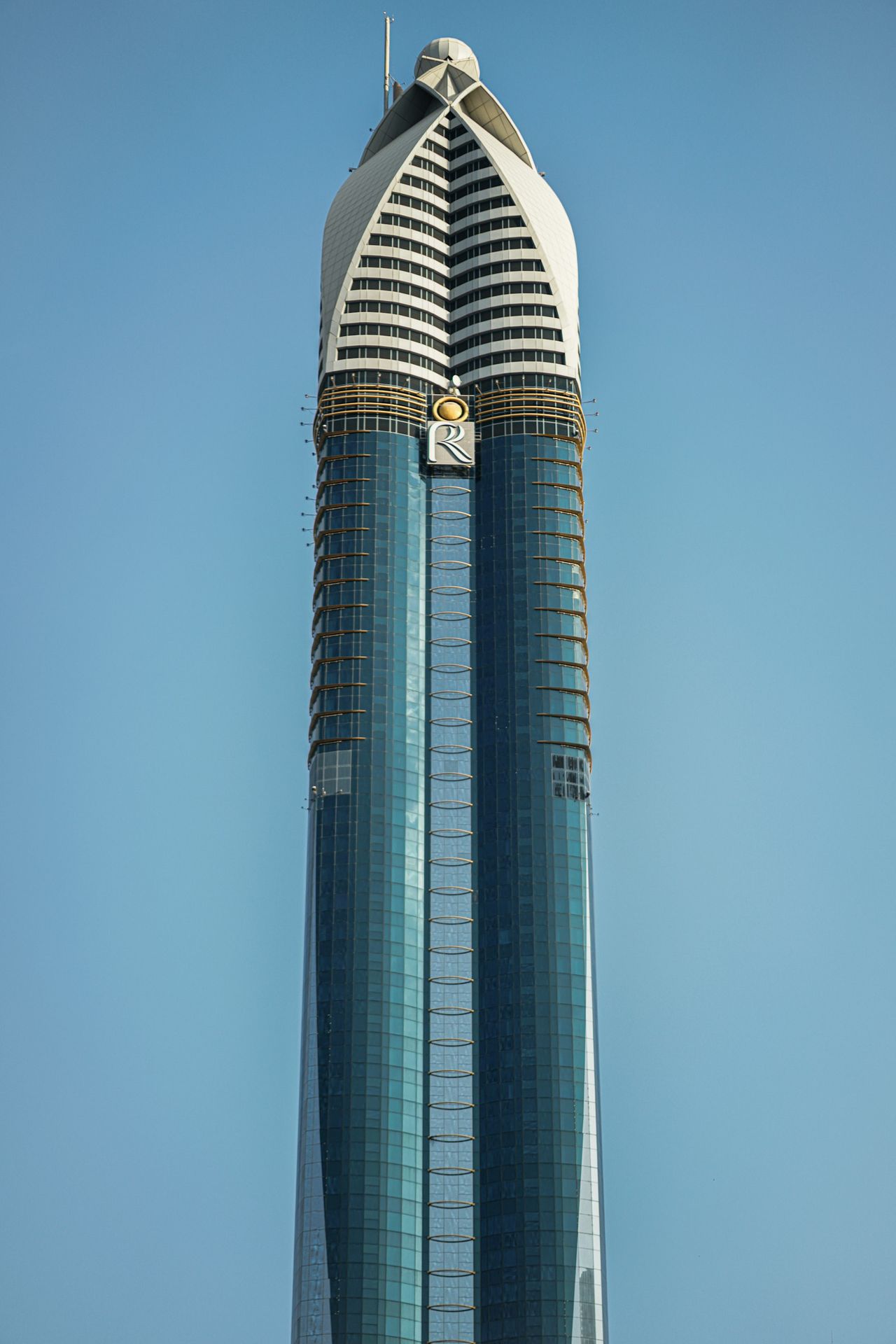 A very tall building with a sky background