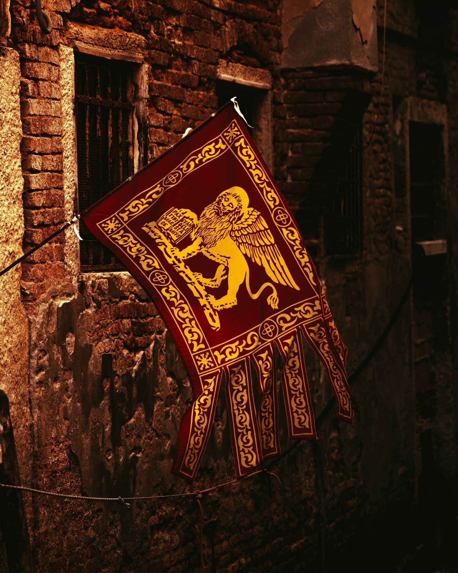 a flag on a brick wall