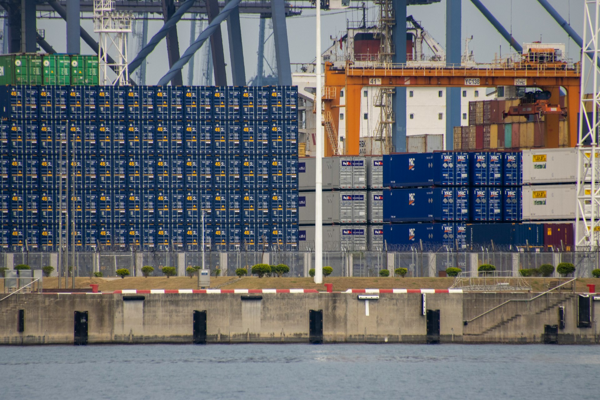 blue and white concrete building near body of water during daytime